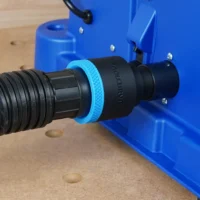 Black ToolCurve 1-7/8 inch hose adapter with blue collar joining a vacuum hose to the blue Kreg Foreman rear dust port