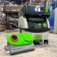 Bright green Macam reusable filter bag for Festool CT Mini/Midi dust extractor, displayed in front of the installed extractor unit