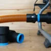 Use your shop vac 1-1/4th shop vac hose with your Ridgid table saw