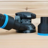Black 2-1/2 inch hose adapter with blue ring standing beside a Flex FX3411 sander and vacuum hose