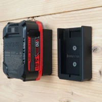 Two black Craftsman 20V battery wall mounts screwed to a wood wall, one holding a 5.0Ah battery