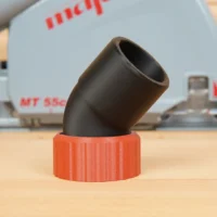 Red 3D-printed dust port adapter with black hose connector angled upward, shown standalone on wood surface